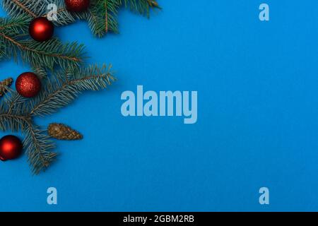 top view. new Year's layout on a blue background. spruce branches. mock up Stock Photo