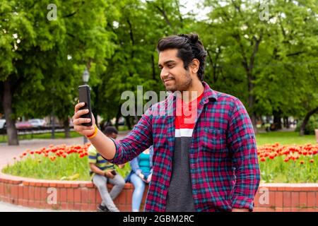Student having online call with his family Stock Photo