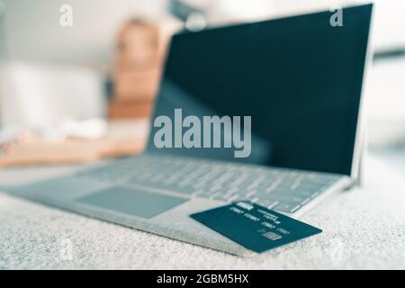 Online shopping on laptop at home concept. Credit card payment with computer over the internet. Technology device web security Stock Photo