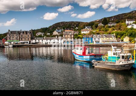 Argyll, Scotland, UK - June 3, 2011: Fishing boats are moored in a harbour at Tarbert village on Loch Fyne in Argyll in the West Highlands of Scotland Stock Photo