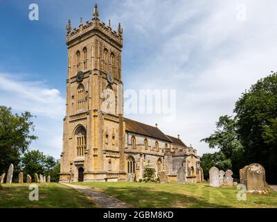The traditional gothic parish church of St Martin in Kingsbury Episcopi village, with its distinctive Ham stone Somerset Tower. Stock Photo