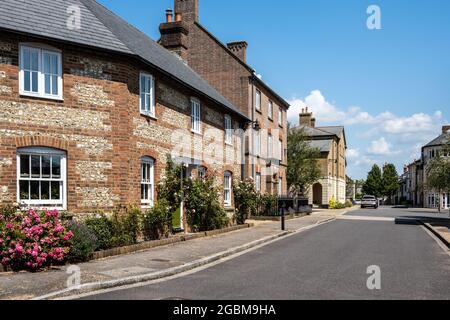 New build town houses and cottages in traditional styles, including flint and brick, in Poundbury new town, Dorset. Stock Photo