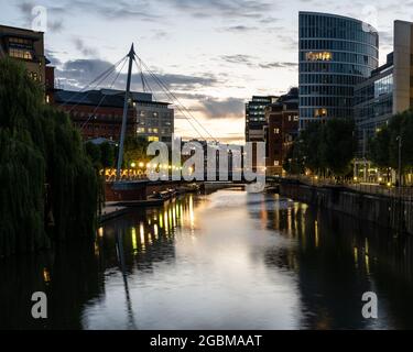 Sunset lights up the sky above Temple Quay on Bristol's Floating Harbour. Stock Photo
