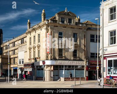 Sun shines on the restaurants and shops of Regent Street in the seaside town of Weston-Super-Mare. Stock Photo