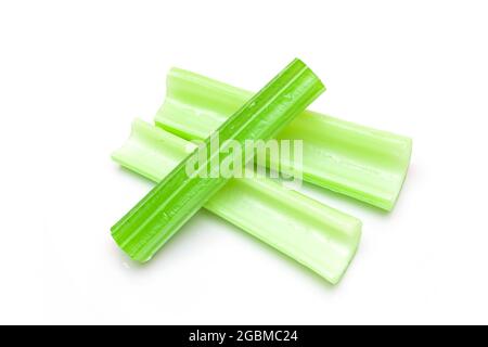 Fresh Chopped Celery Sticks with Water Drops Isolated on White Background. Vegan and Vegetarian Culture. Raw Food. Healthy Diet with Negative Calorie Content Stock Photo