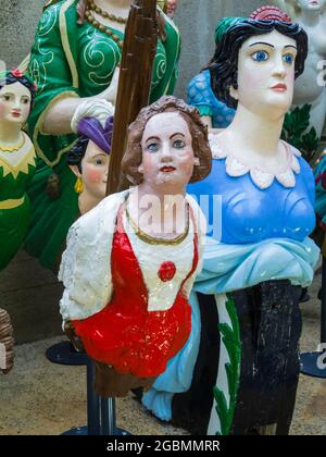 Display of traditional figureheads in the Cutty Sark, a British clipper ship and popular tourist attraction in dry dock in Greenwich, London, England Stock Photo