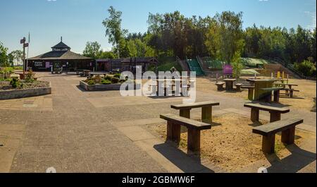 von Heath Country Park visitor centre building with picnic tables and children's play area  on a sunny morning. No people. Saint Leonards, Ringwood. Stock Photo