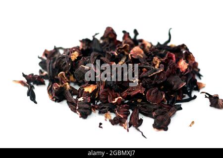 Dried Roselle herbs isolated on white background, a dark red-purple colored bissap wonjo natural herbs, flowers of the Roselle plant Hibiscus used to Stock Photo