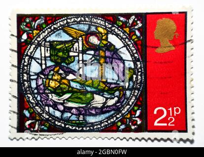 A postage stamp printed in the United Kingdom shows The dream of wise men, dream of the Kings, from Stained Glass Windows, Canterbury Cathedral, circa
