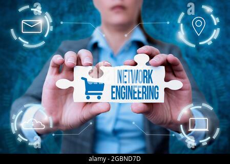 Sign displaying Network Engineering. Business showcase field concerned with internetworking service requirement Business Woman Holding Jigsaw Puzzle Stock Photo