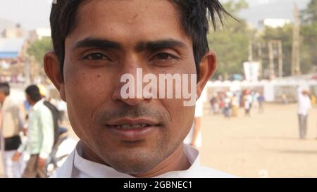 Young Indian man in traditional clothes walking outdoor Stock Photo