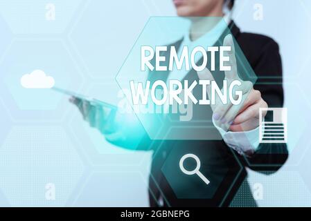Conceptual caption Remote Working. Concept meaning style that allows professionals to work outside of an office Woman In Suit Holding Tablet Showing Stock Photo