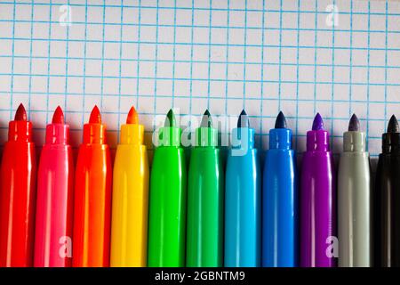 Opened multicolored markers on notebook, nobody Stock Photo