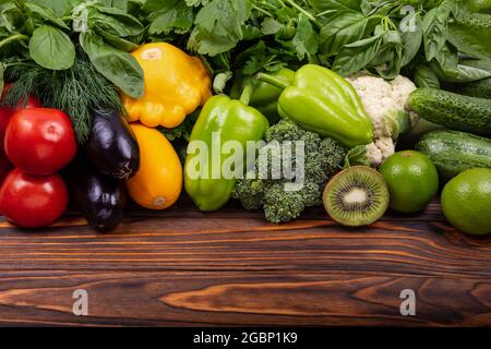 Flat lay with various vegetables on wooden table. Ingredients Stock Photo