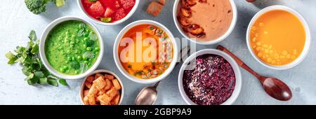 Vegan soup assortment panorama with many different vegetable cream soups, fresh spring detox panoramic banner, shot from above Stock Photo
