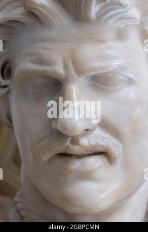 A closeup, detail of the stone, marble head of the sculpture, statue of the Dying Gaul, Galatian. At the Capitoline Museum in Rome, Italy. Stock Photo