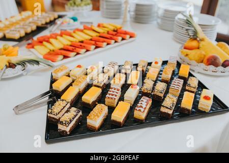 Assortment of various desserts on a table for wedding Stock Photo
