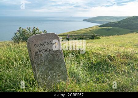 Dorset- Dancing Ledge marker stone on the Coastal path along the Jurassic Coast near Swanage Stock Photo