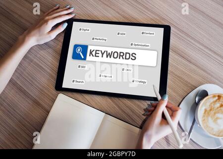 Keywords. SEO, Search engine optimization and internet marketing concept on screen Stock Photo