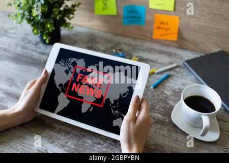 Fake news sign on screen. Propaganda and disinformation. Media and internet concept Stock Photo