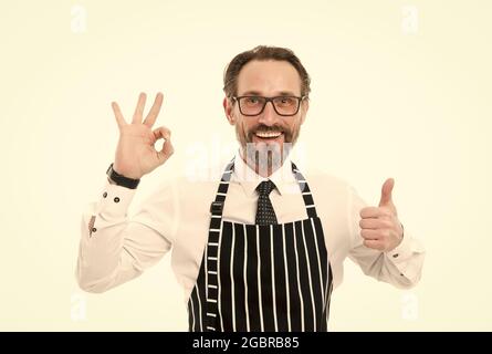 best and perfect. best mature male cook isolated on white. confident chef in apron. perfect cooking in kitchen. bearded man baker in glasses. catering Stock Photo