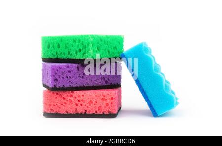 Multicolored kitchen sponges for cleaning isolated on a white background, set of wash tool Stock Photo