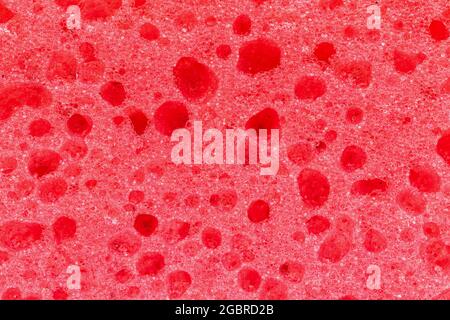 Sponge foam red texture close-up, abstract pattern Stock Photo