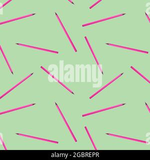 Seamless pattern with pink pencils on green background. Stock Photo