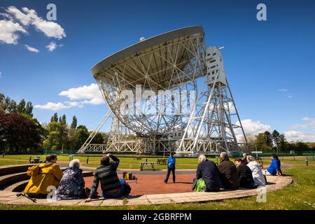 UK, England, Cheshire, Goostrey, University of Manchester, Jodrell Bank, visitors at Telescope Talk, beside Lovell Radio Telescope Stock Photo