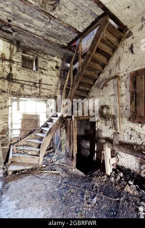 Wooden Staircase in an abandoned Farm urban exploration lost place Stock Photo