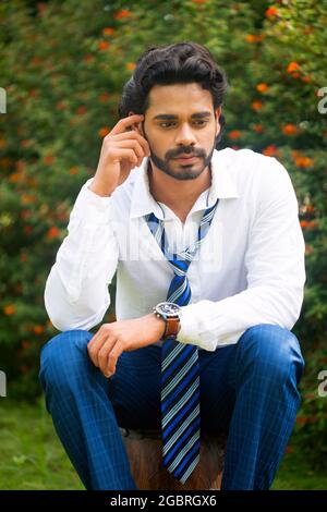 Young male model in garden Stock Photo