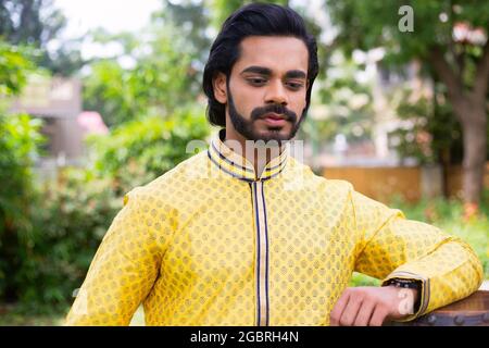 Young male model in yellow kurta Stock Photo