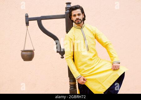 Young male model in yellow kurta Stock Photo