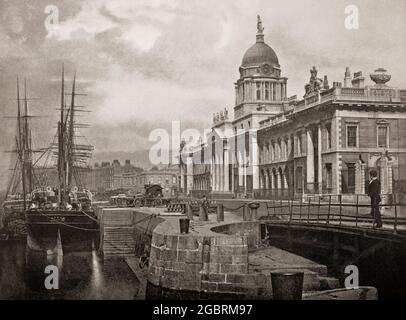 A late 19th century view of the neoclassical 18th century Custom House alongside the River Liffey in Dublin, Ireland. In 1781 James Gandon was appointed architect, after Thomas Cooley, the original architect on the project died. Construction started in 1781  and for his assistants Gandon chose Irish artists such as Meath stone-cutter Henry Darley, mason John Semple and carpenter Hugh Henry. Every available mason in Dublin was engaged in the work. When it was completed and opened for business on 7 November 1791, it had cost £200,000 to build – a considerable sum at the time. Stock Photo