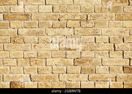 Beige brick wall. Abstract textured brick background. Space for text Stock Photo