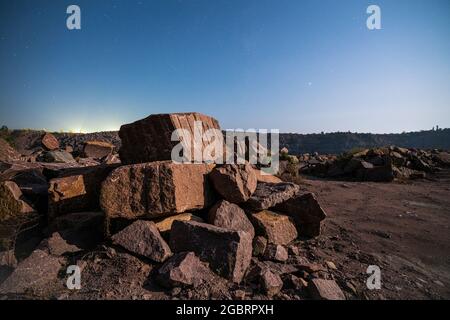 Large deposits of stone materials near a mining quarry Stock Photo