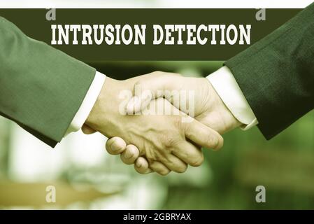 Text showing inspiration Intrusion Detection. Business showcase monitors a network or systems for malicious activity Two Professional Well-Dressed Stock Photo
