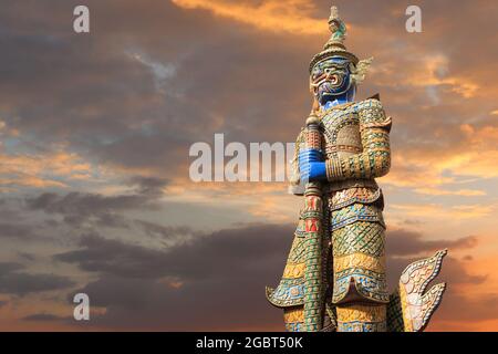 Giant statues in Thai literature on twilight evening sky background and have copy space for design in your work. Stock Photo