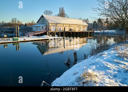 Scotch Pond Snow Steveston. The historic net shed at Garry Point, Steveston covered in snow. Richmond, BC. Stock Photo