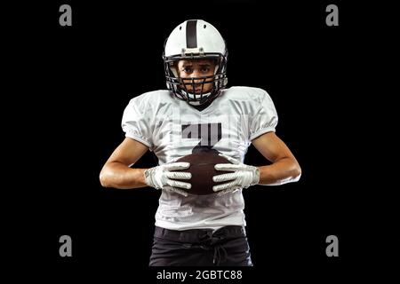 Close Up Portrait Of American Football Player In Sports Equipment Helmet And Gloves Isolated On Dark Studio Background Concept Of Sport Competition Stock Photo Alamy