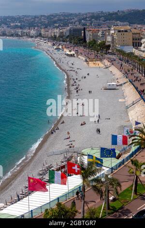 Flags of the European Union and other countries fluttering in the wind on the city embankment. Nice. France. Stock Photo