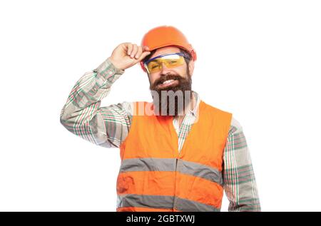Bearded man worker with beard in building helmet or hard hat. Man builders, industry. Building glasses. Portrait of a builder smiling. Builder in hard Stock Photo