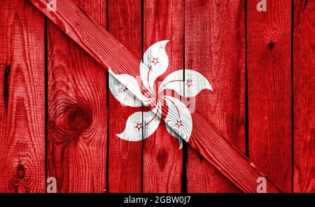 Hong Kong flag is depicted on a wooden background close-up Stock Photo