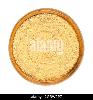 Powdered and dried orange peel, in a wooden bowl. Ground skin of organic, sweet and aromatic oranges, used for baking, or for teas. Stock Photo