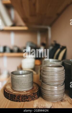 Pottery workshop products on table close up. Handmade, creativity and hobby concept. Stock Photo