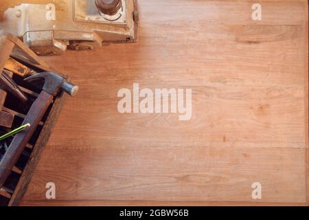 Desk of a carpenter with different tools. Studio shot on a wooden background,vintage style Stock Photo