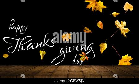 Happy Thanksgiving text with leaves over dark wood background Stock Photo
