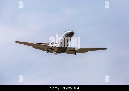 photograph of an airplane few seconds before landing Stock Photo