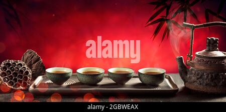 Tea - Japanese Ceremony With Hot Teapot And Teacups On Red Background Stock Photo