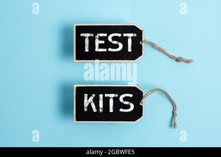 Hand writing sign Test Kits. Word Written on tools used to detect the presence of something in the body Collection of Blank Empty Sticker Tags Tied Stock Photo